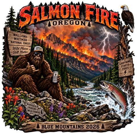 A square graphic design featuring a dramatic wildfire scene in Oregon with the text 'Salmon Fire Oregon' at the top. The artwork shows a Bigfoot / Sasquatch sitting on the left holding a can of beer, a fish jumping from water on the right, a Bald Eagle surveying the scene, a lightning bolt, and multiple wooden signs with text. 'BLUE MOUNTAINS 2026' at the bottom of the scene.